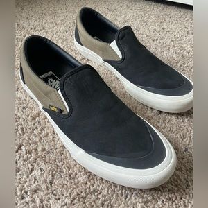 Men’s size 12 black and olive green Vans.